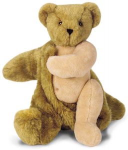 A brown teddy bear removing it's outer fur to reveal flesh colored fur underneath.